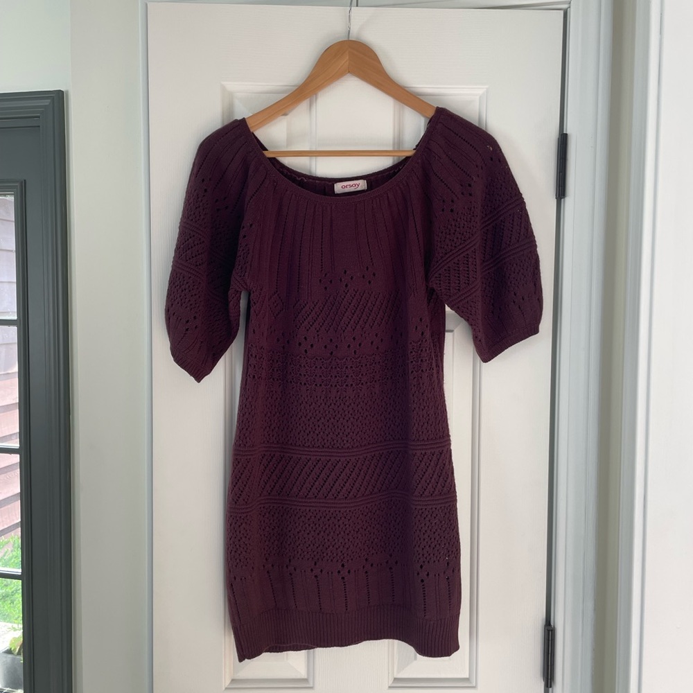 Deep plum, mid thigh sweater dress.